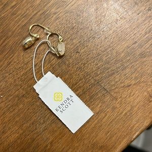 Kendra got gold earrings sold with dust bag brand new with tags